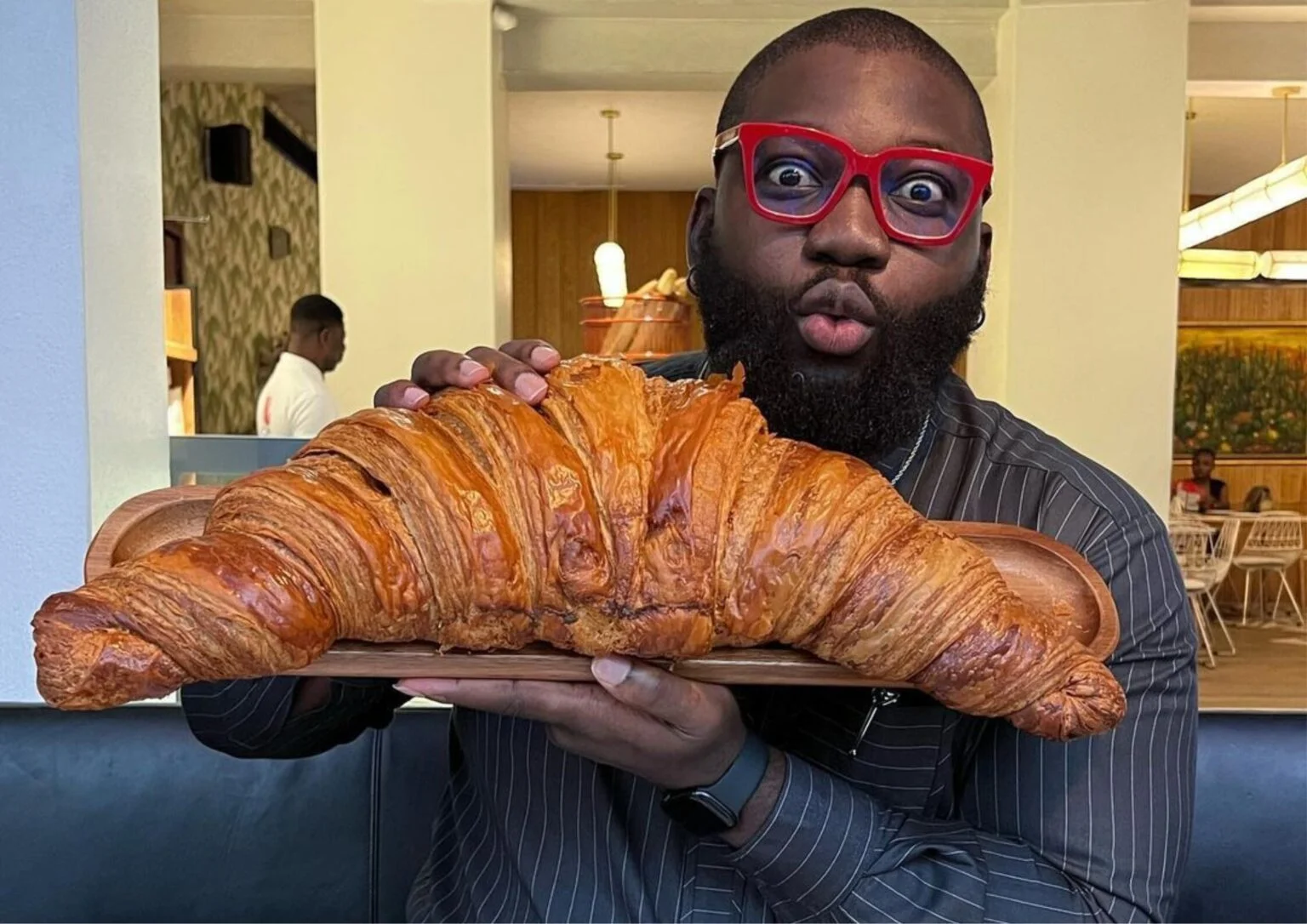Opeyemi Famakin holding a bread